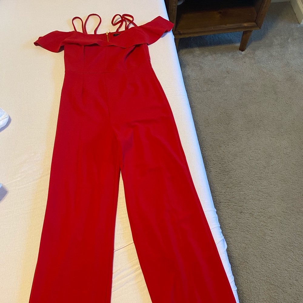 Red jumpsuit.